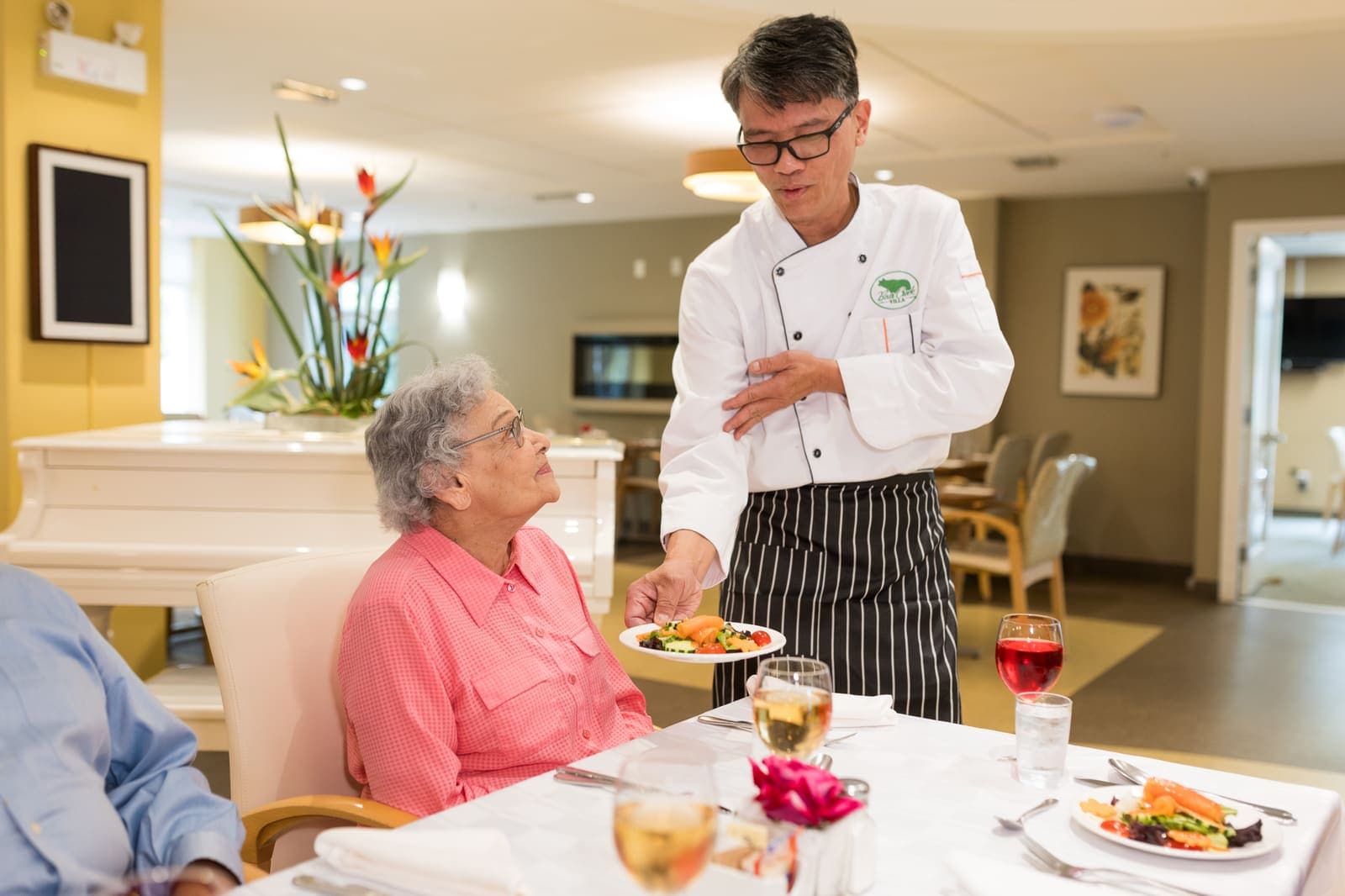 Our chef serving freshly plated meals in the Sunflower Restaurant