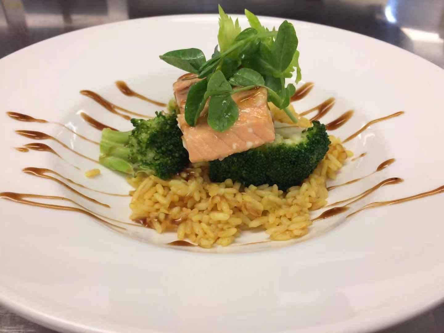 Seared salmon plated by our kitchen